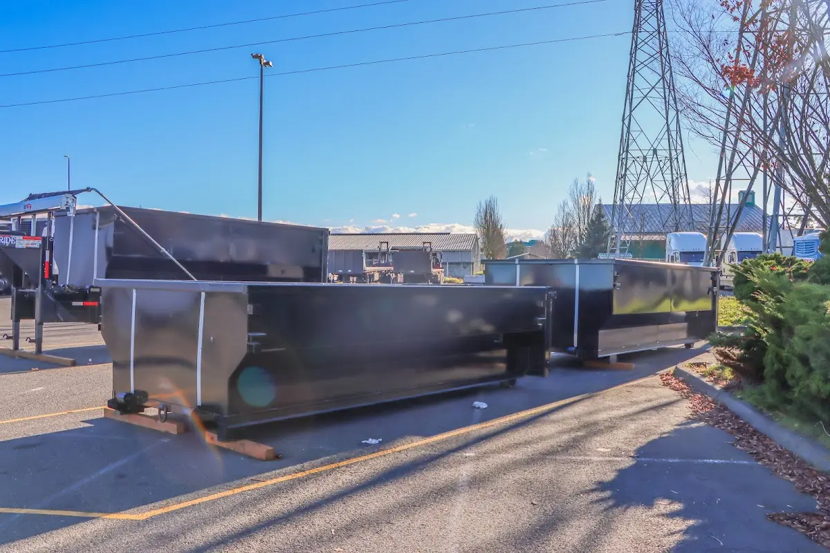 Roll-off dumpster ready for waste disposal at job site for Concrete Dumpster Rental in Milford